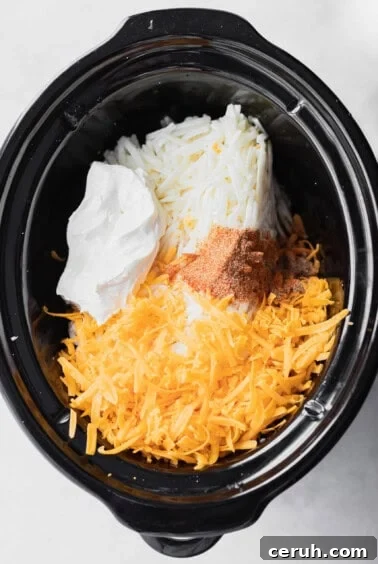 a cheesy crock pot filled with potatoes.