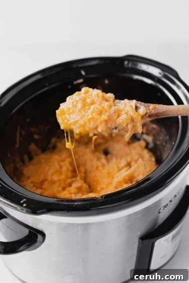 stirring cheesy potatoes