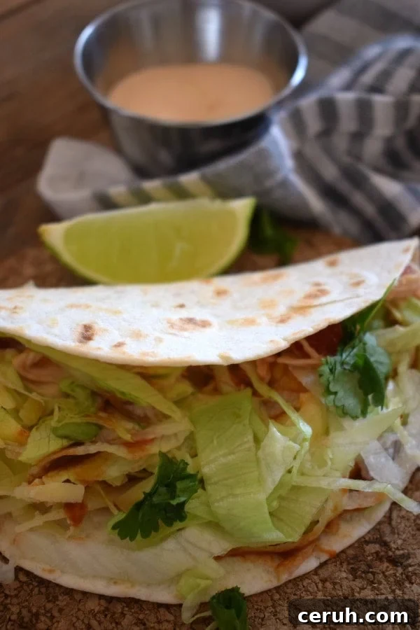 Slow-Cooker Shredded Chicken Tacos Recipe 8 Close up view of the Slow Cooked Shredded Chicken Tacos