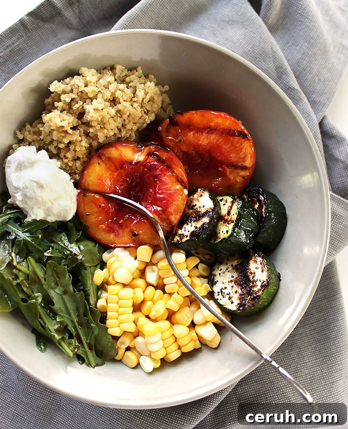 Grilled Peach and Zucchini Summer Bowls - Packed with fresh summertime ingredients: grilled peaches, fresh sweet corn, grilled zucchini, arugula, quinoa, and goat cheese! The perfect end of summer recipe! Vegetarian/gluten free