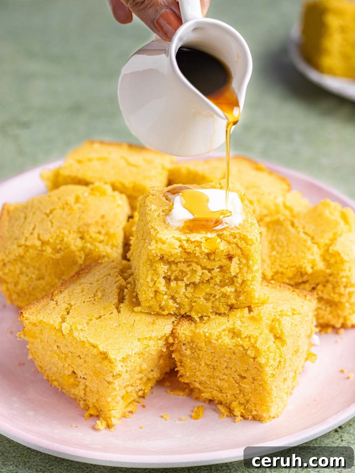 drizzling maple syrup over cornbread.