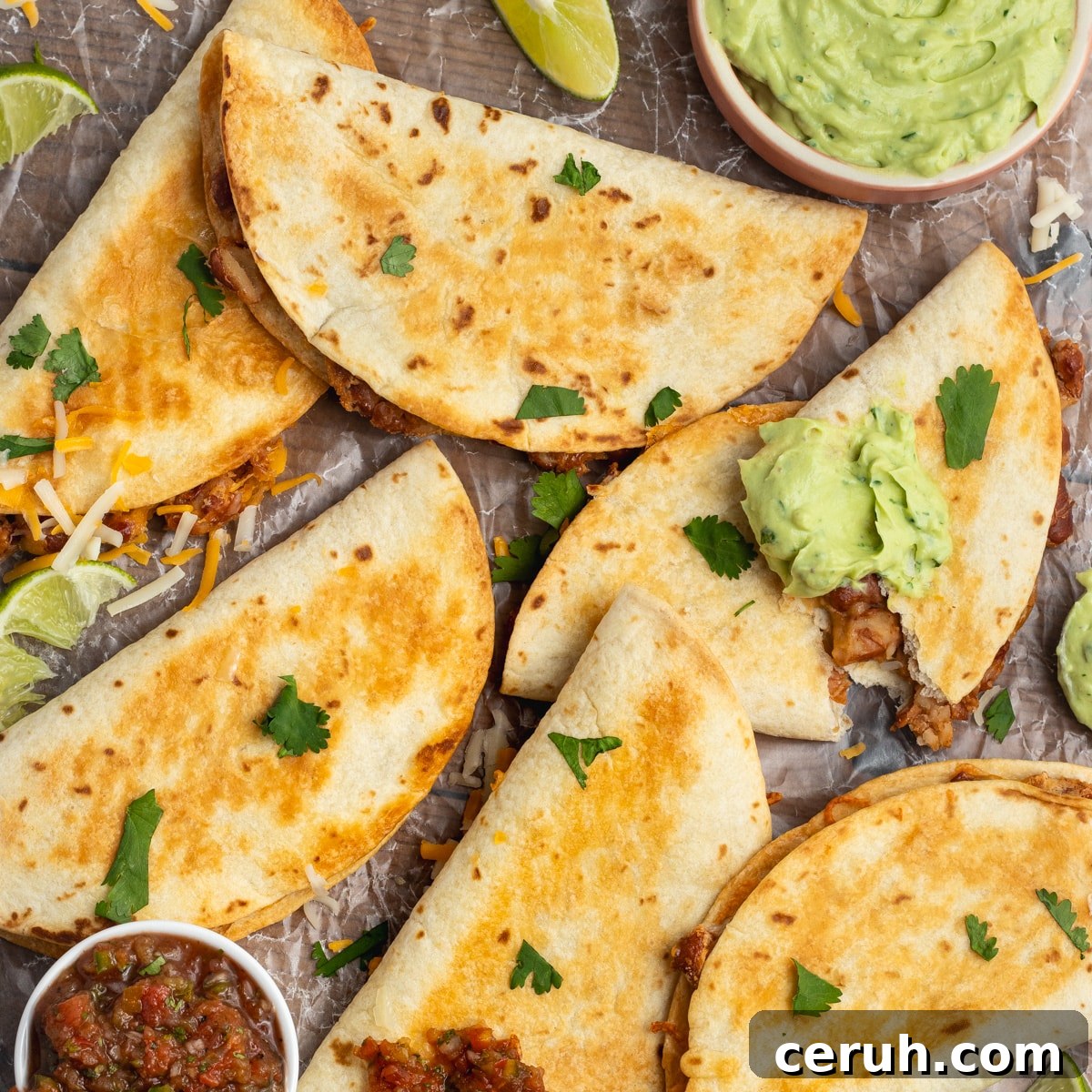 Baked Crispy Bean and Cheese Tacos with Avocado Crema