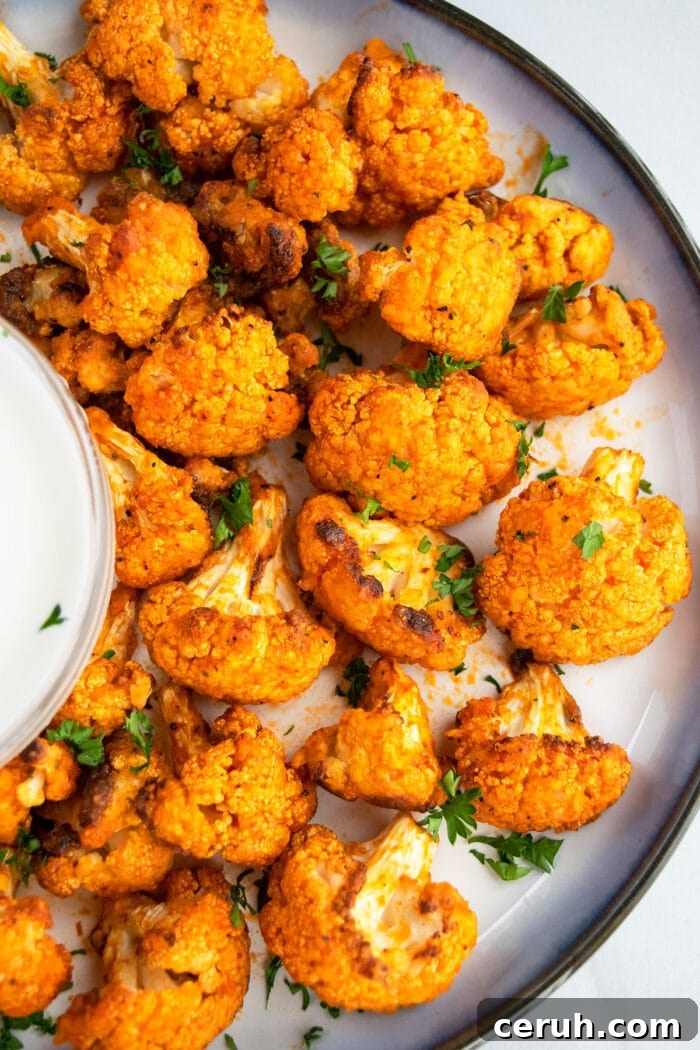 Oven Baked Buffalo Cauliflower Wings Recipe on White Plate- Overhead Shot. 