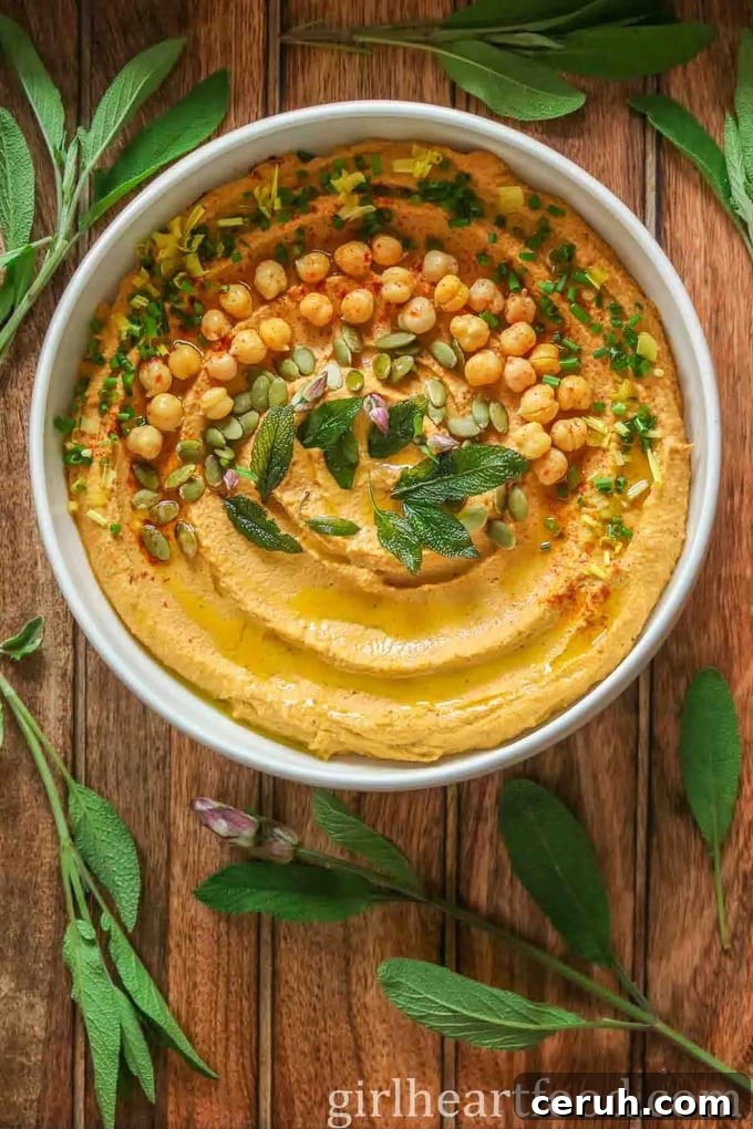 17 Delicious Pumpkin Recipes: Savory Dishes & Sweet Treats 10 Pumpkin-Hummus-Recipe in white bowl