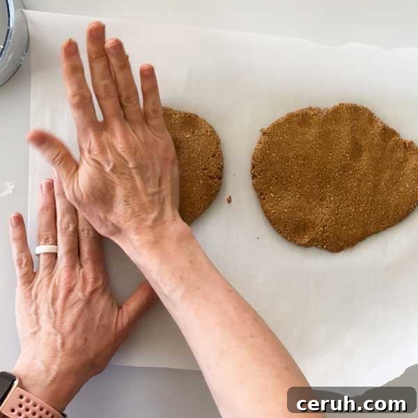 Gluten-Free Graham Cracker Crumbs for Baking and Desserts 6 Spreading the graham cracker bits dough by hand on a parchment paper.