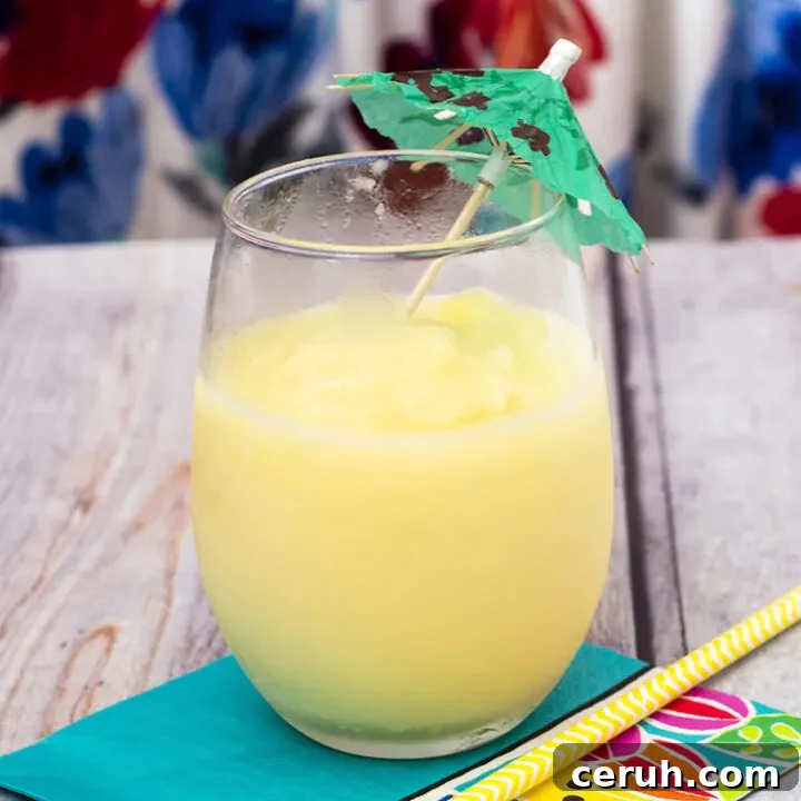 Have a taste of the tropics with a homemade frozen pina colada: a blend of ice, pineapple slices and juice, coconut cream and rum. #SundaySupper TheRedheadBaker.com