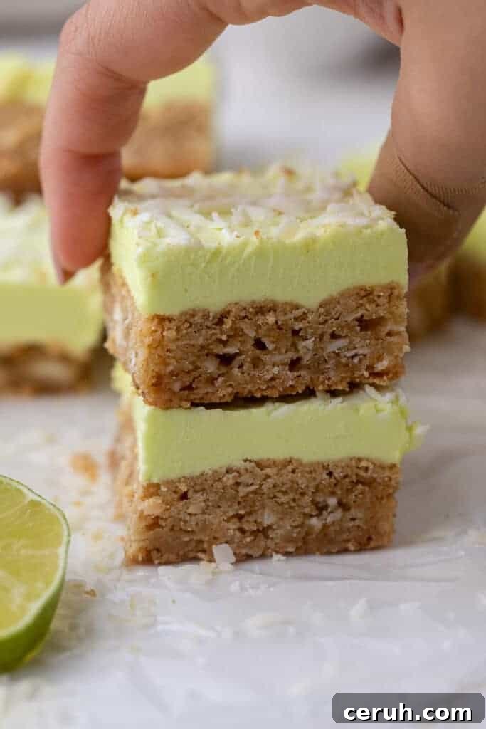 Hand grabbing lime coconut bars