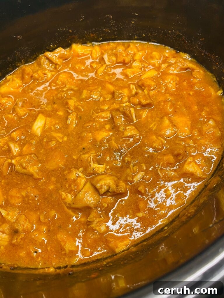 Slow-Cooker Taco Chicken Recipe for Busy Weeknights 5 chicken for tacos in the slow cooker