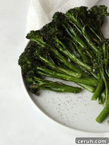 tender roasted broccolini on a plate