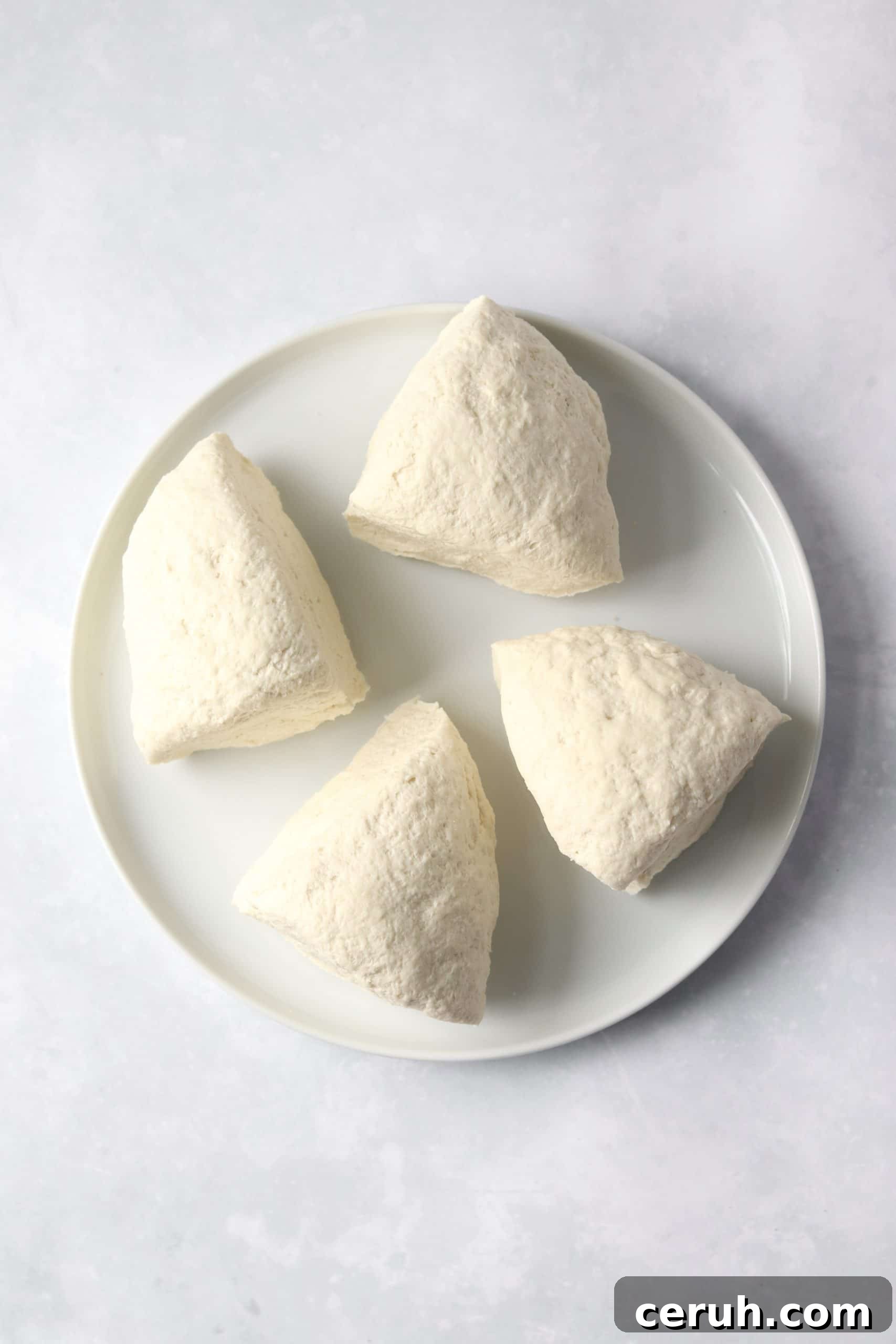 flatbread dough in 4 pieces.