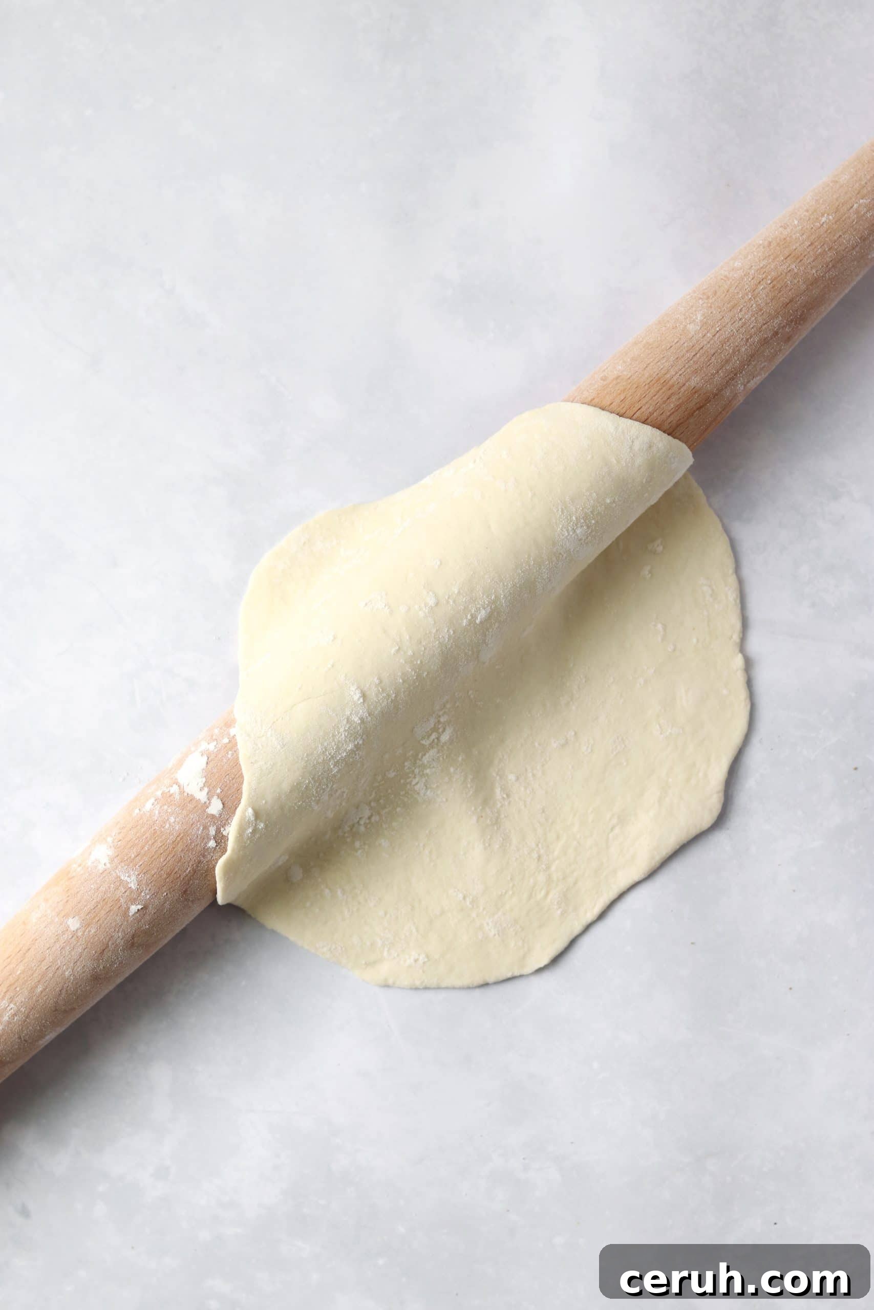 rolled flatbread on rolling pin.