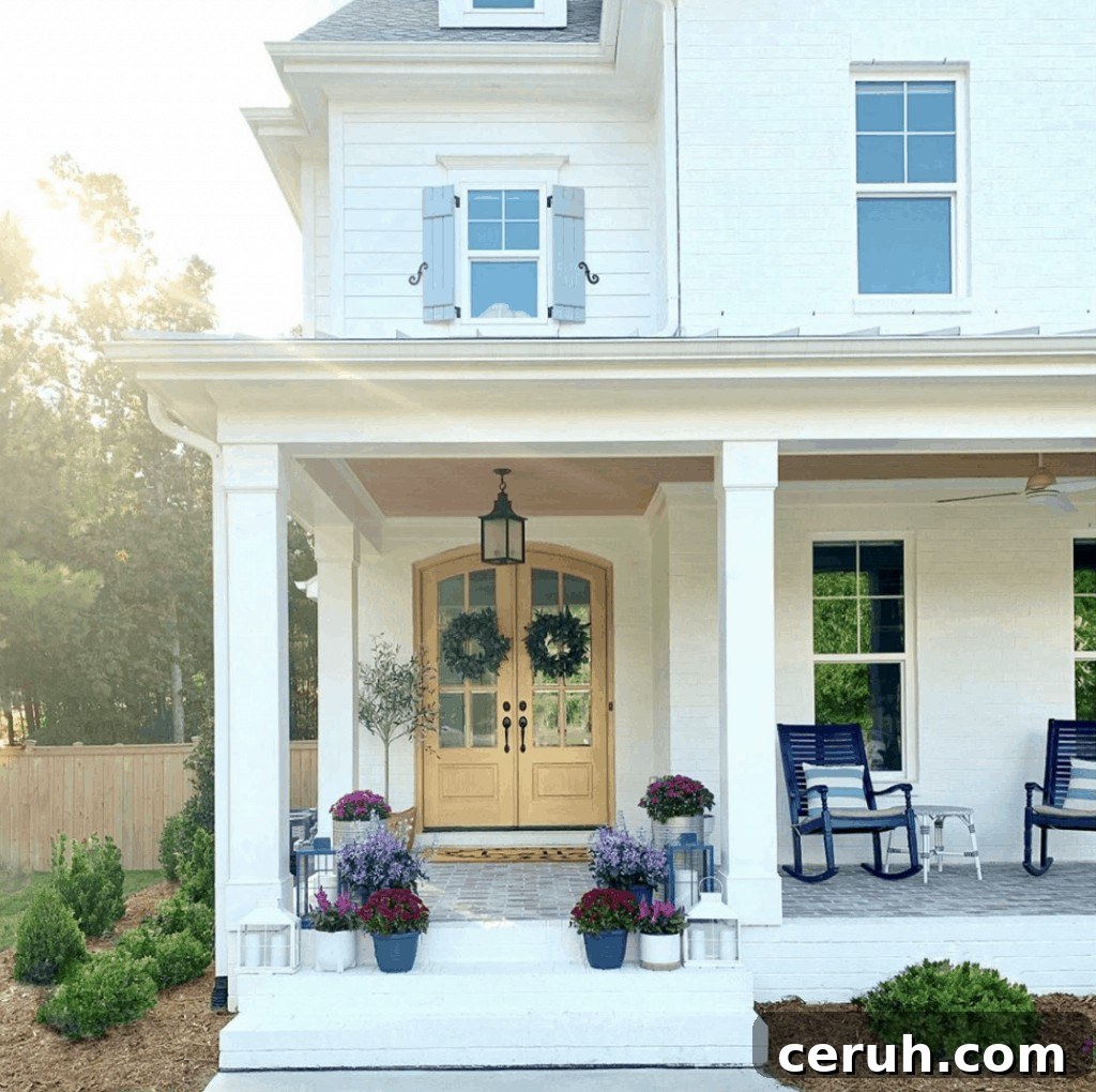 front porch with purple mums