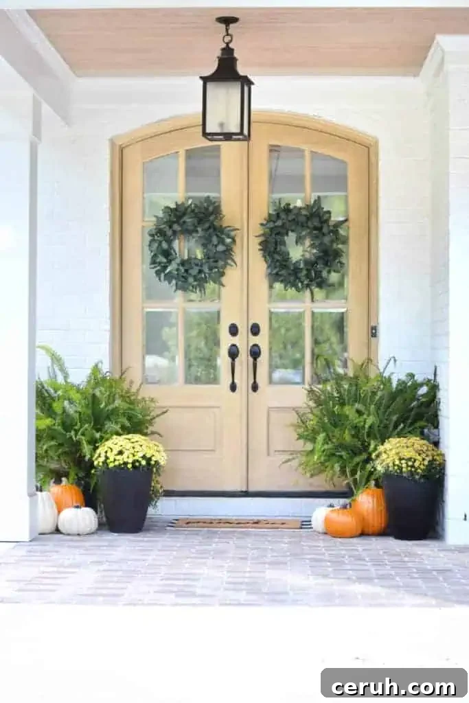 Fall front porch with mums and ferns