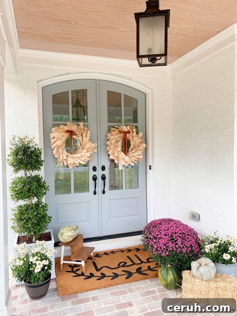 fall window boxes, corn husk wreaths on a front door