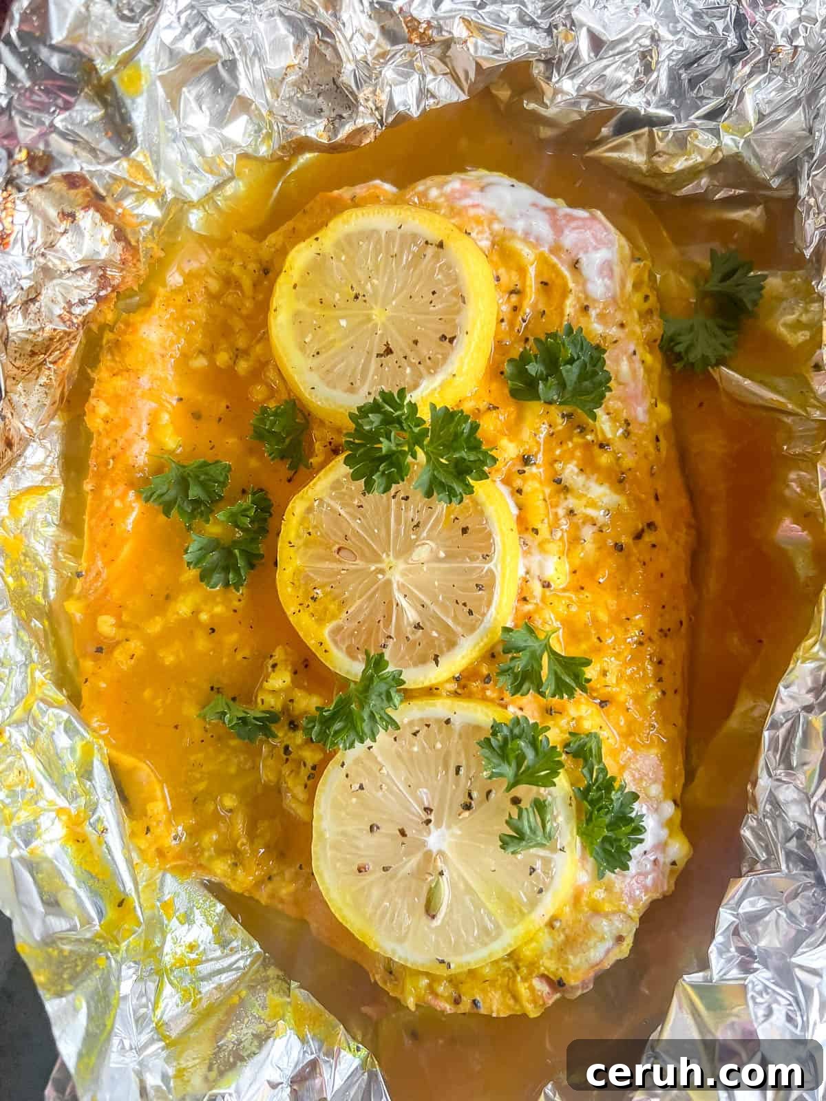 Baked turmeric salmon in foil just out of oven.