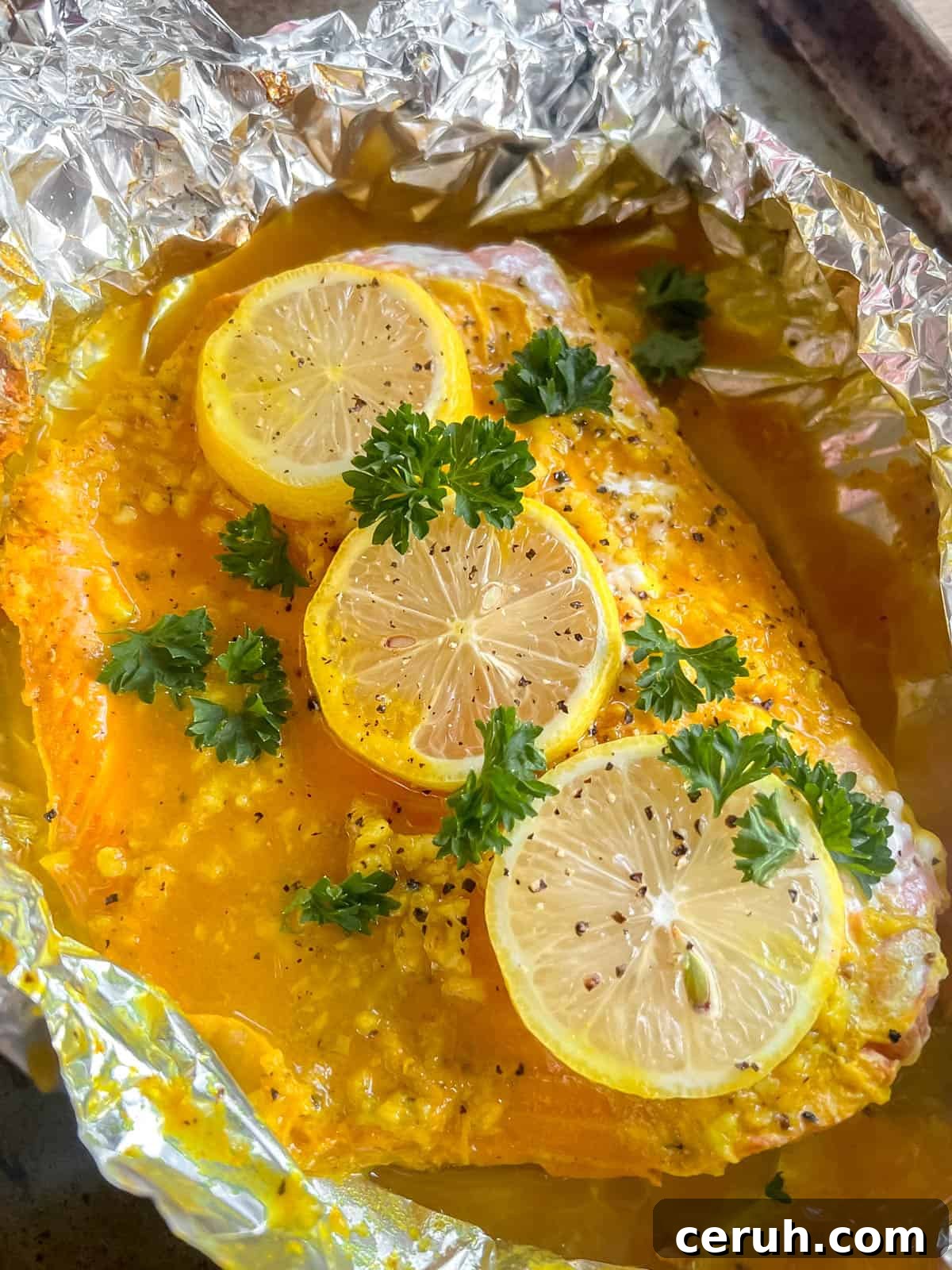 Side angle of lemon ginger turmeric salmon freshly baked.