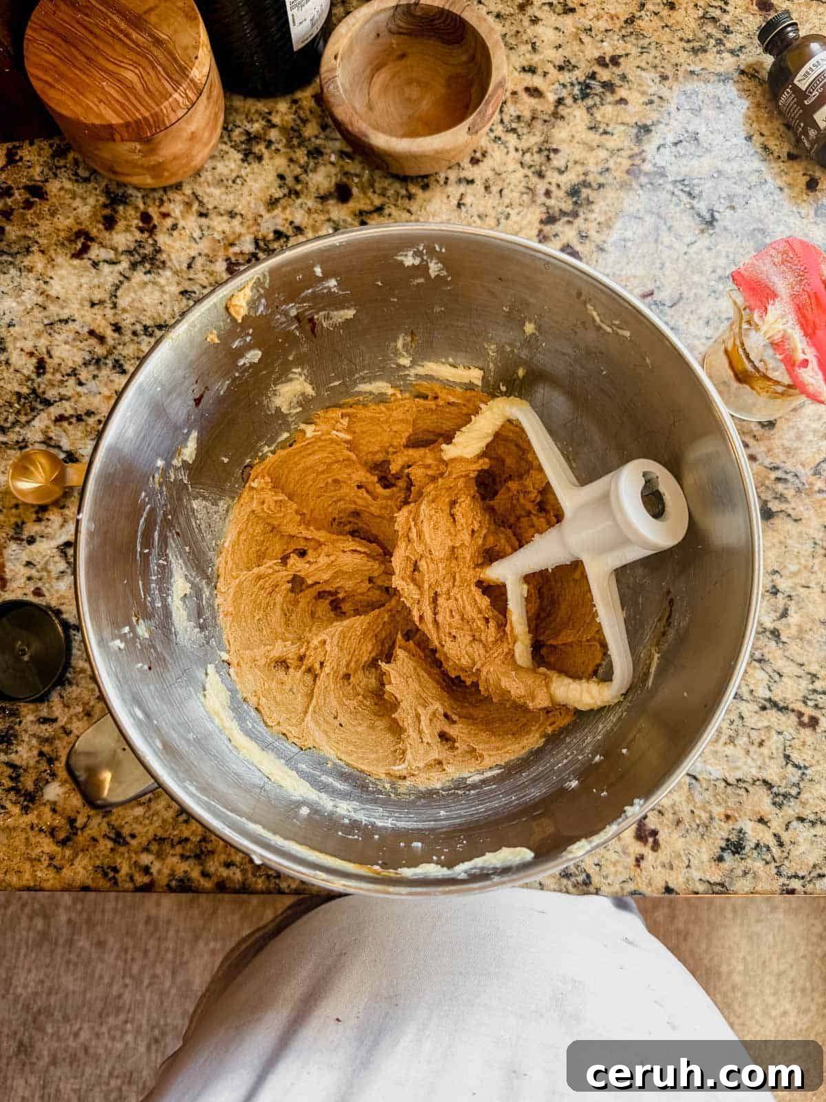 gingerbread latte cookie dough in a stand mixer with the paddle attachment.