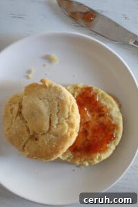 gluten free biscuits split topped with jelly.