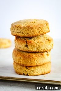 almond flour biscuits stacked on a white counter