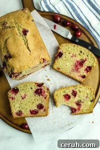 slices of gluten free cranberry orange bread on a platter