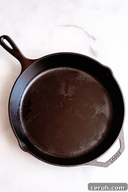Heat oil in cast iron skillet.