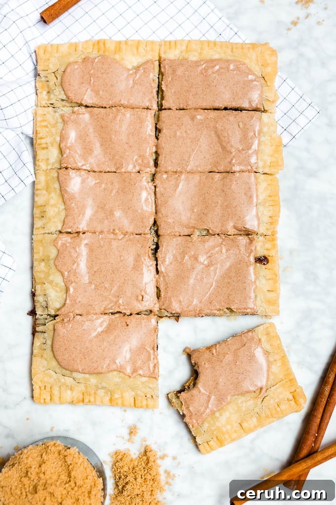 A giant brown sugar cinnamon pop tart sliced into ten pieces.