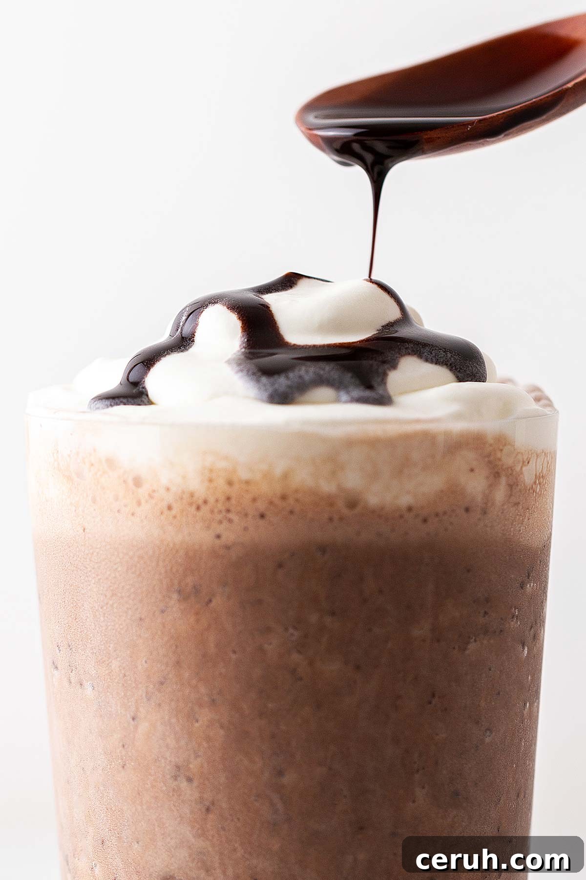 Chocolate drizzled spooned onto a Frappuccino.