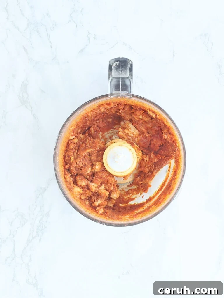 Bacon paste in the bowl of a food processor.