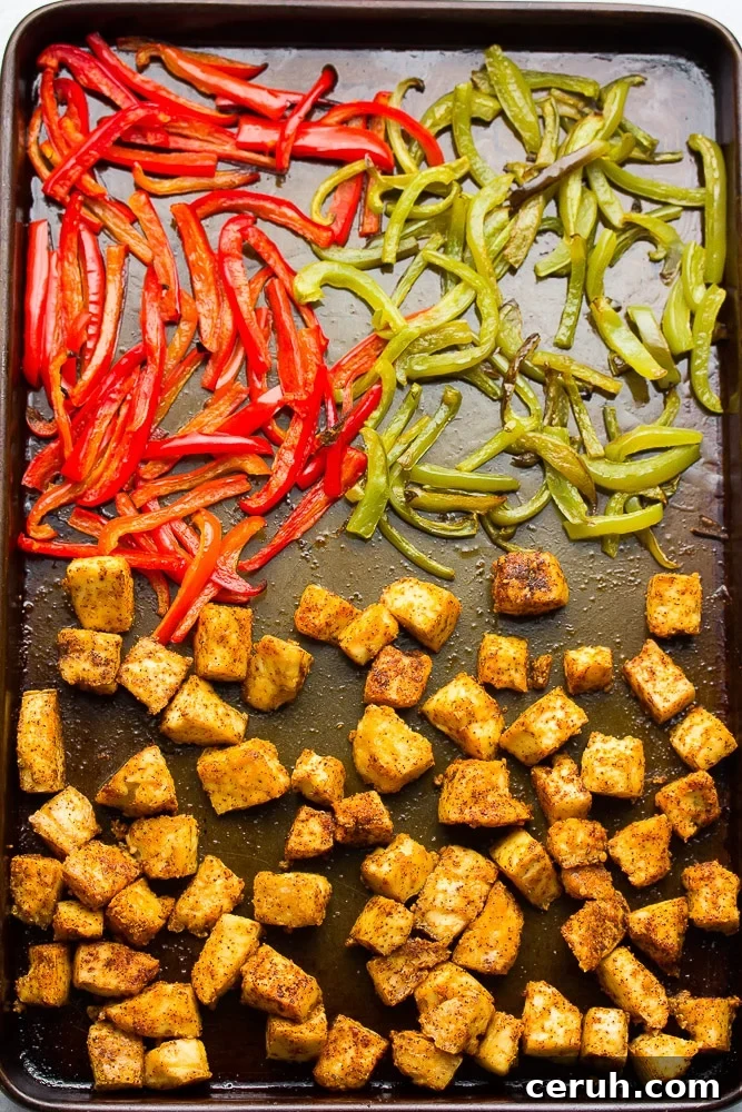 baked crispy tofu and peppers on a sheet pan