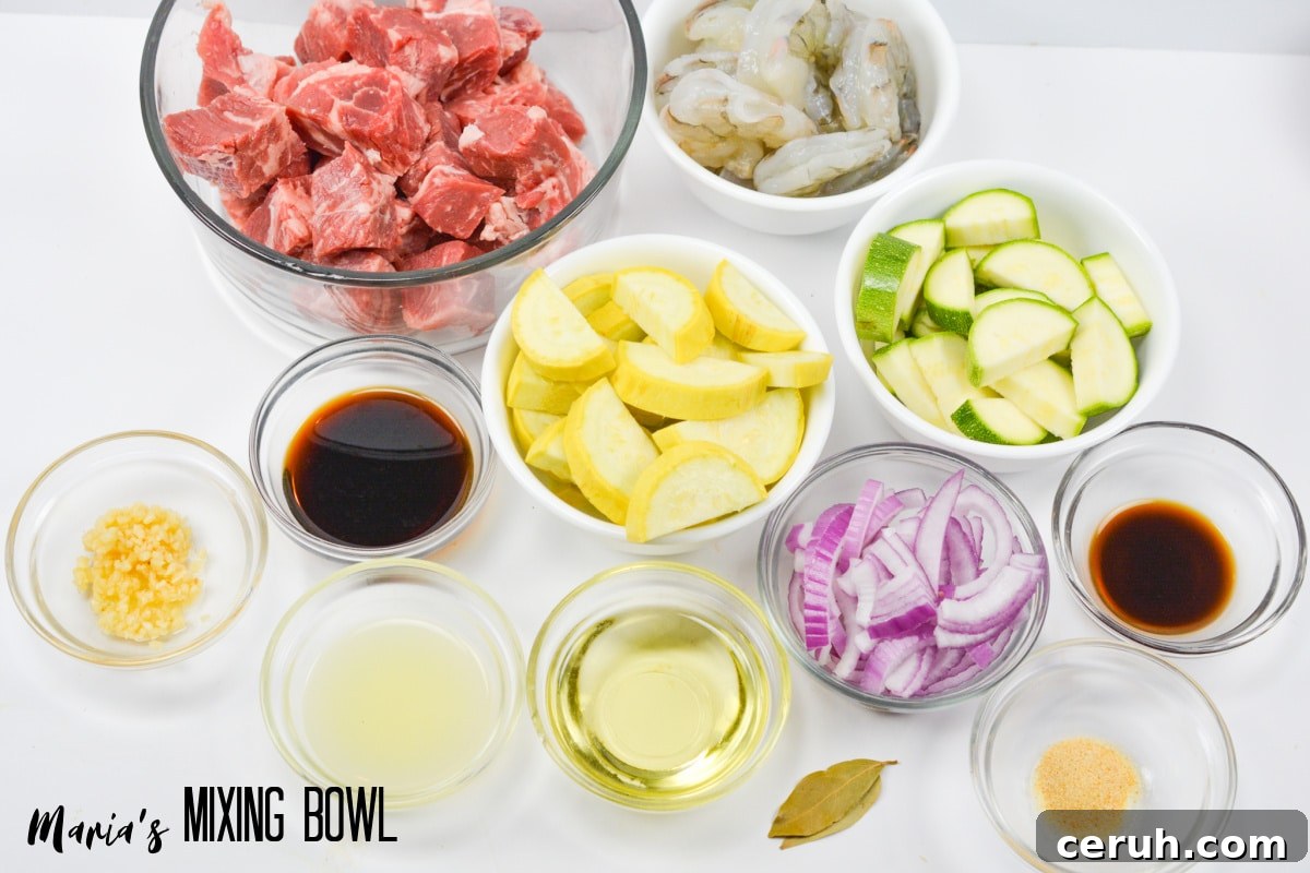 bowls of cut up steak, raw shrimp, yellow squash, zucchini squash, sliced red onions, garlic, bay leaves, oil, Worcestershire sauce, lemon juice, soy sauce, and garlic powder.