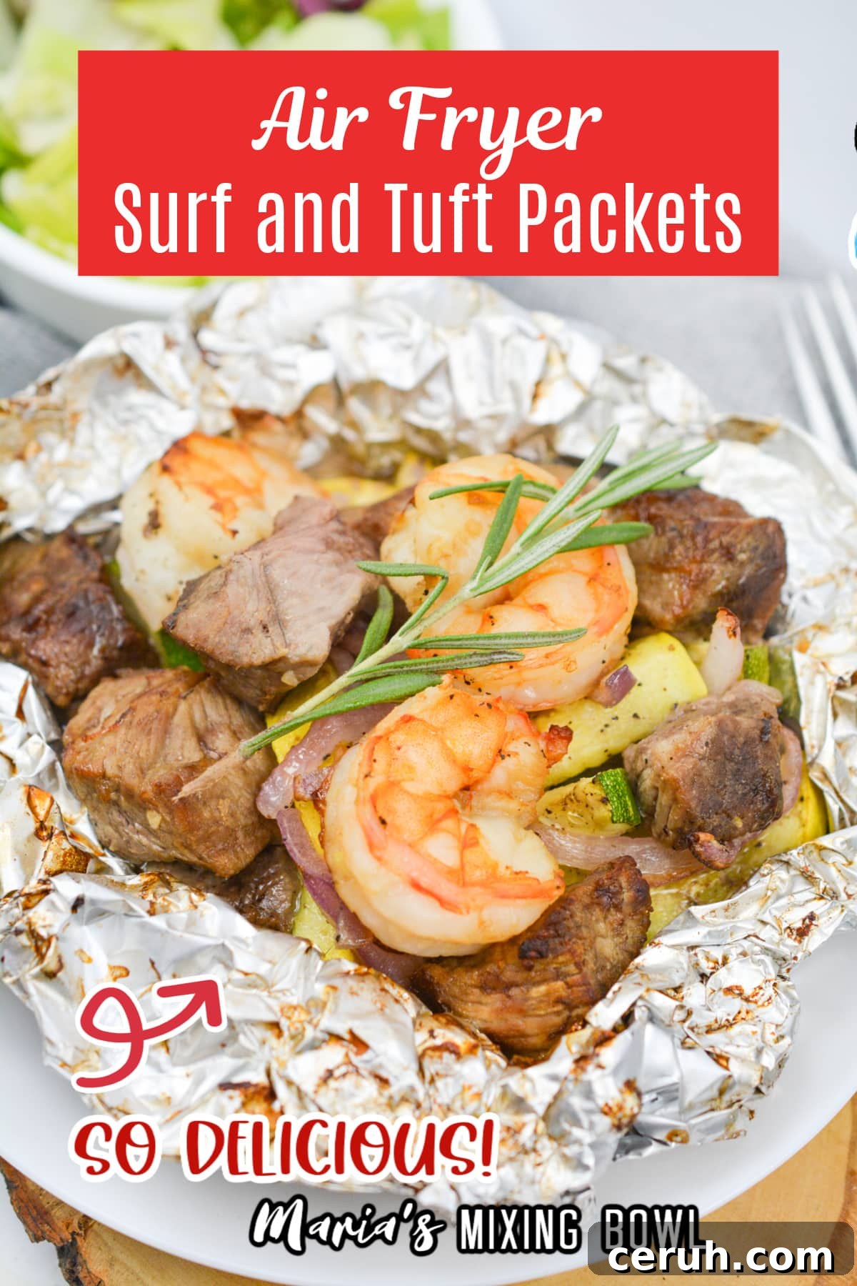 opened foil packet filled with steak, shrimp, and cooked vegetables.