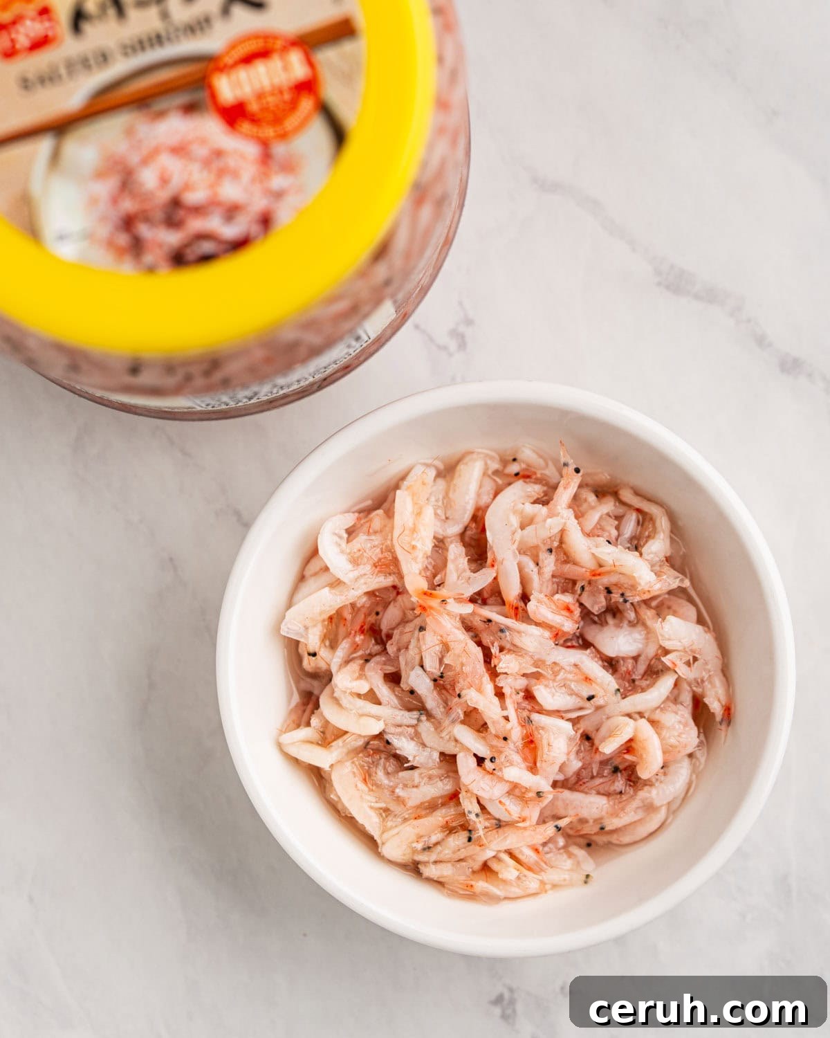 top down of salted shrimp saeujeot in bowl.