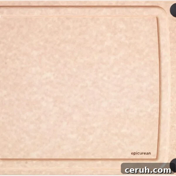 A rectangular, light brown cutting board with a smooth surface.
