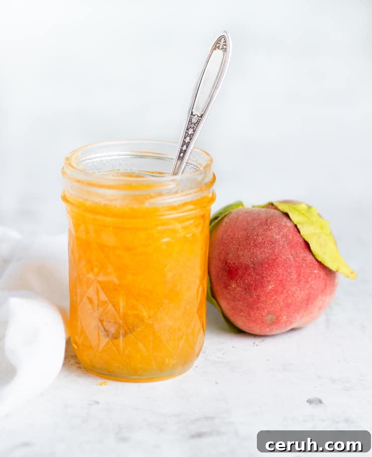 open jar of peach jam