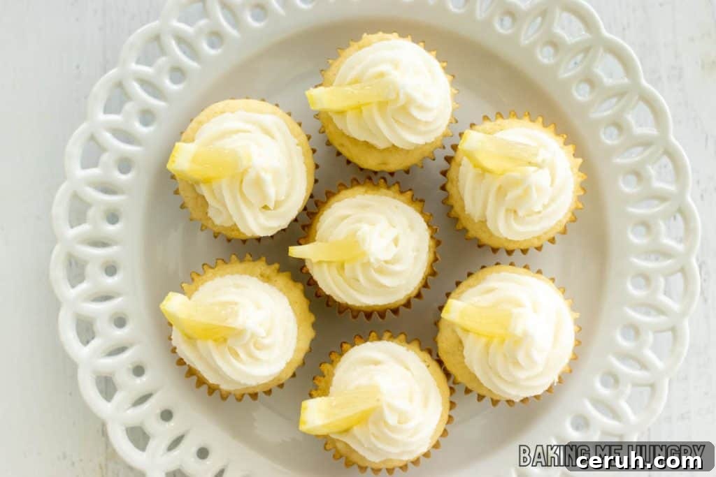 mini lemon cupcakes on decorative white plate from overhead