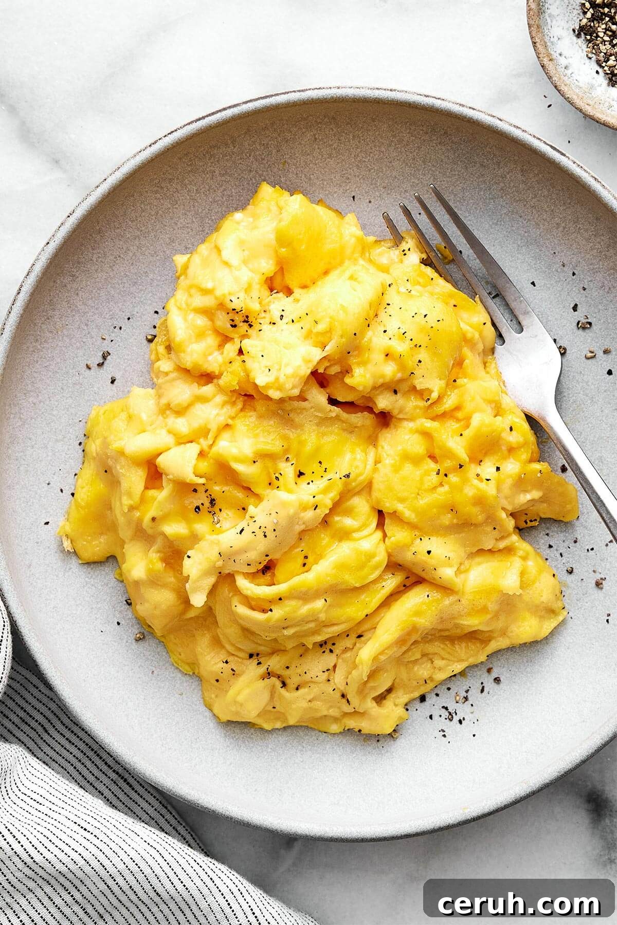 A plate of scrambled eggs.