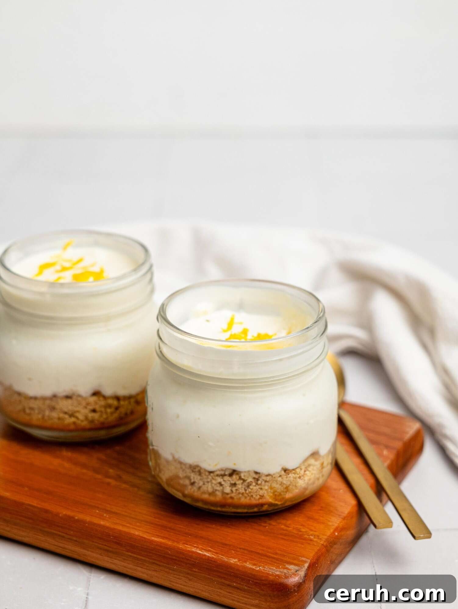 Two lemon cheesecake pots.