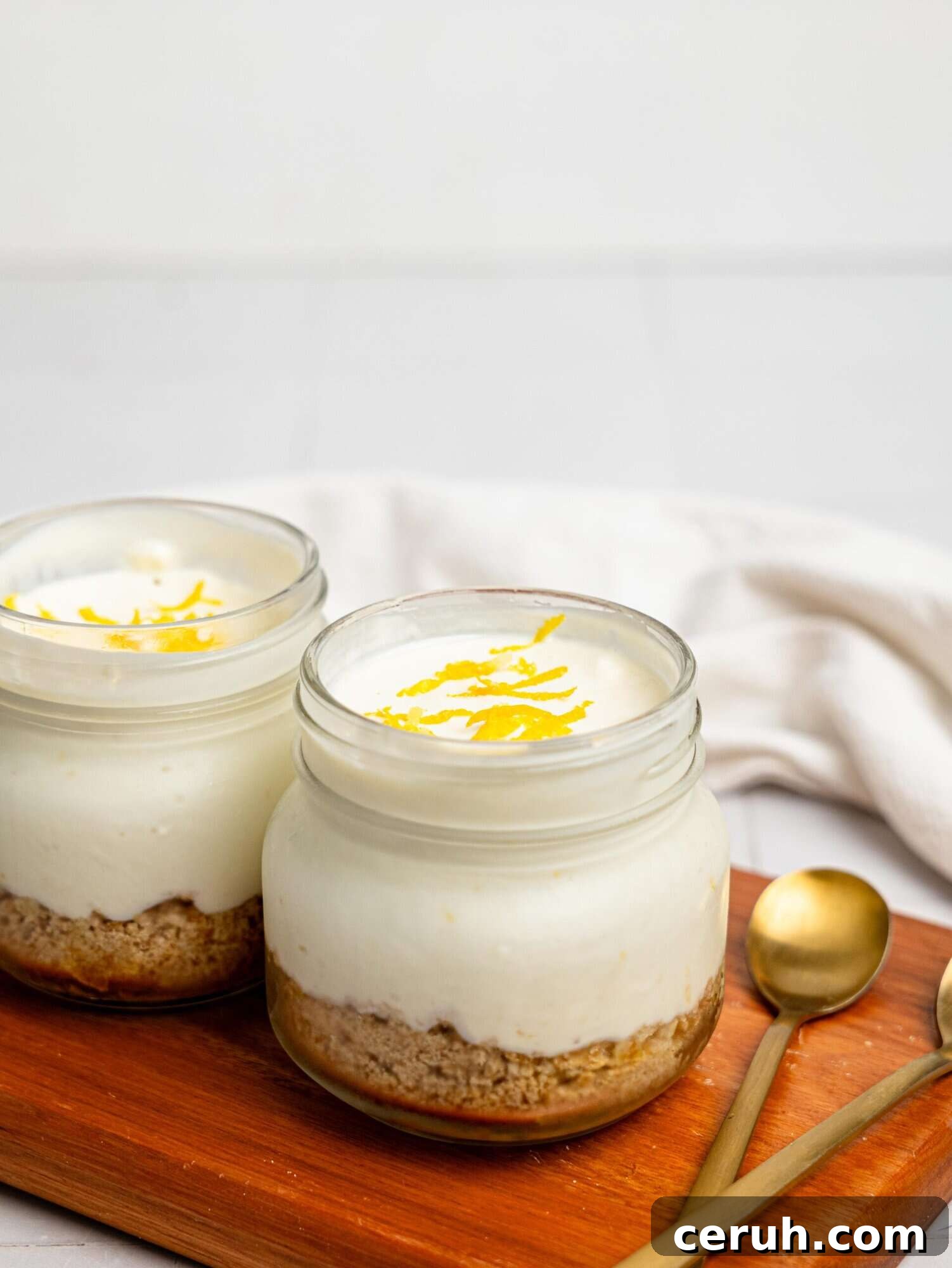 Two lemon cheesecake pots.