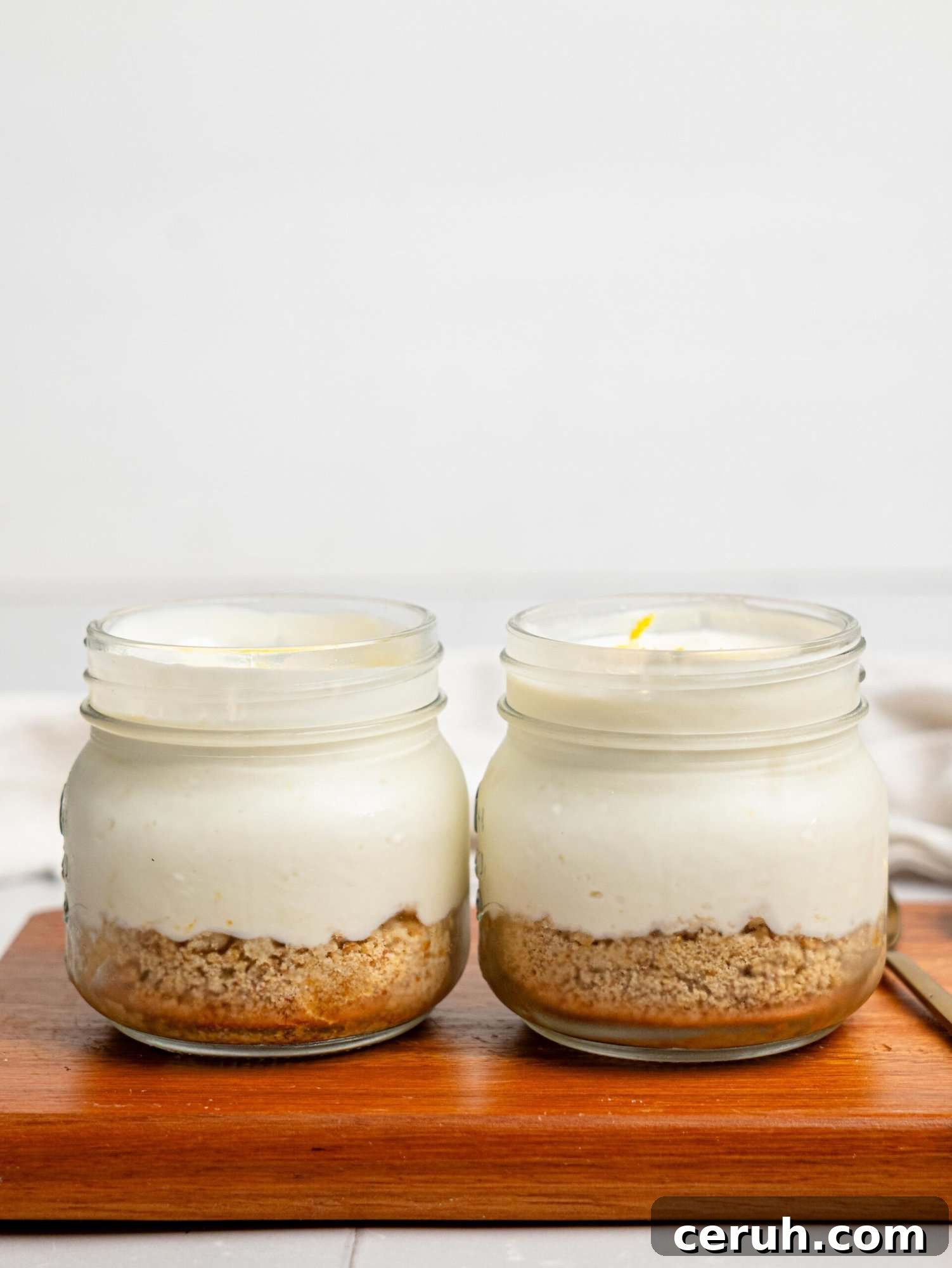 Two lemon cheesecake pots.