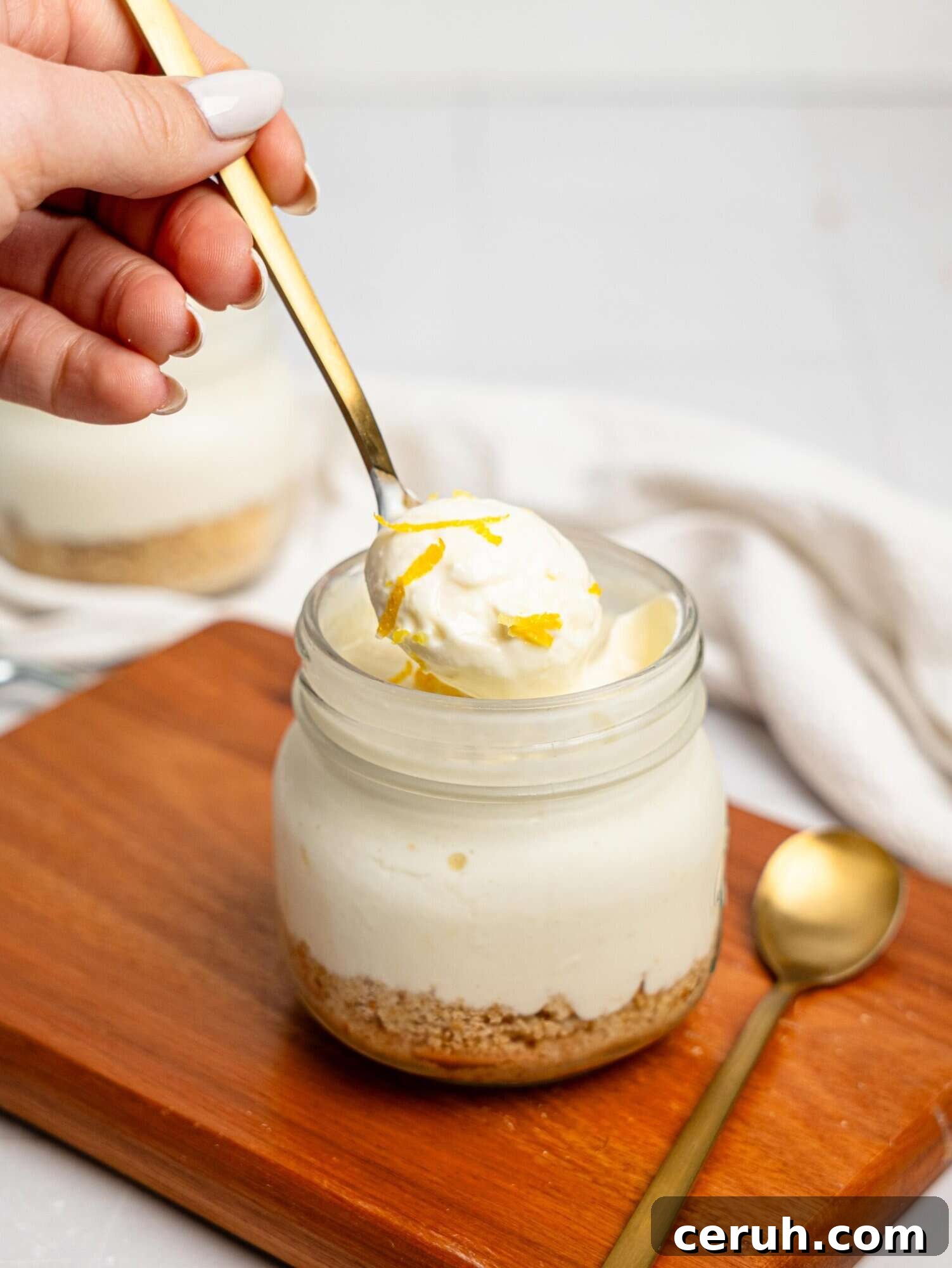 Spooning out a bit of lemon cheesecake pot.
