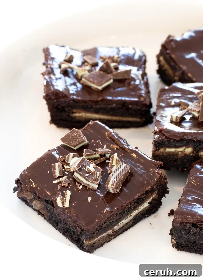 Fudgey chocolate mint Andes brownies on white serving tray