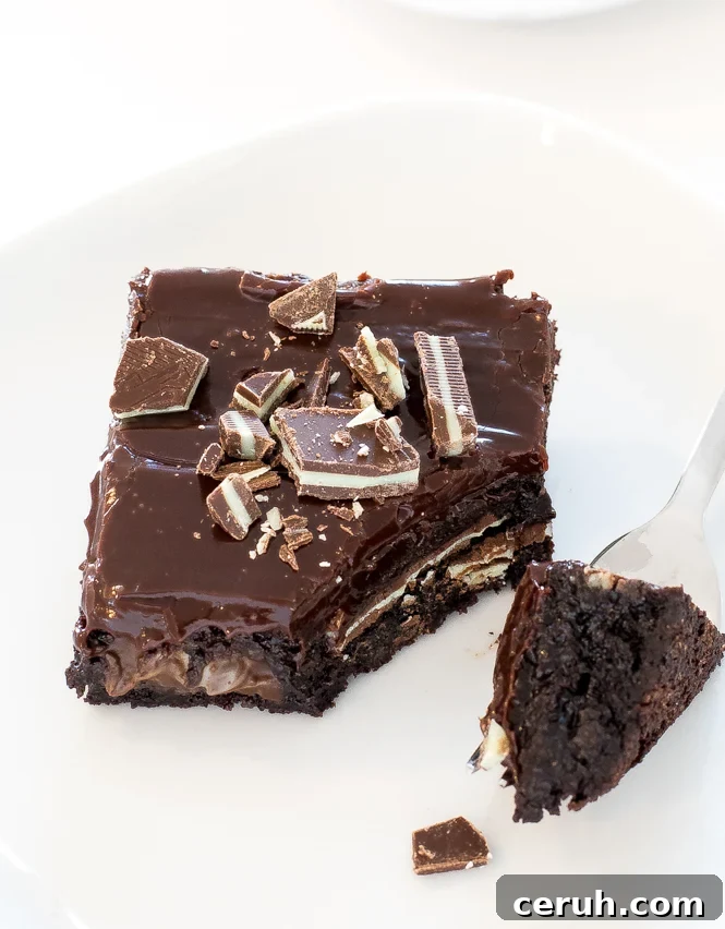 Mint Fudge Brownies on white plate with fork
