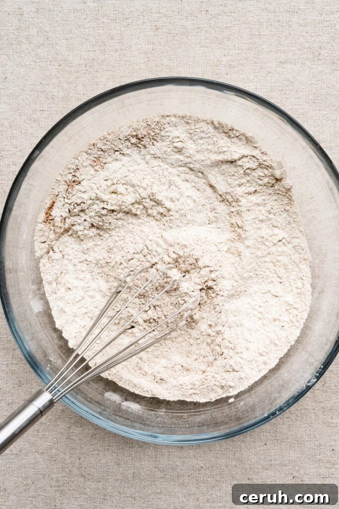 Overhead of flour and spices mixed together in a bowl.