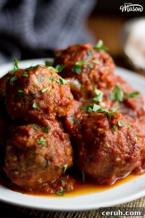 Slow Cooker Meatballs on a plate with parsley scattered on top
