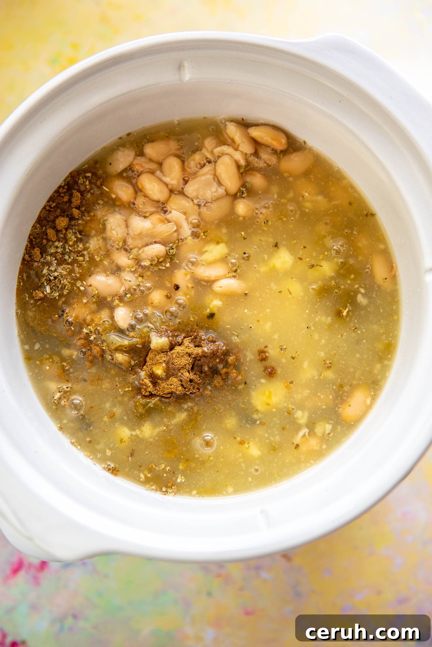 beans, broth and seasoning in slow cooker
