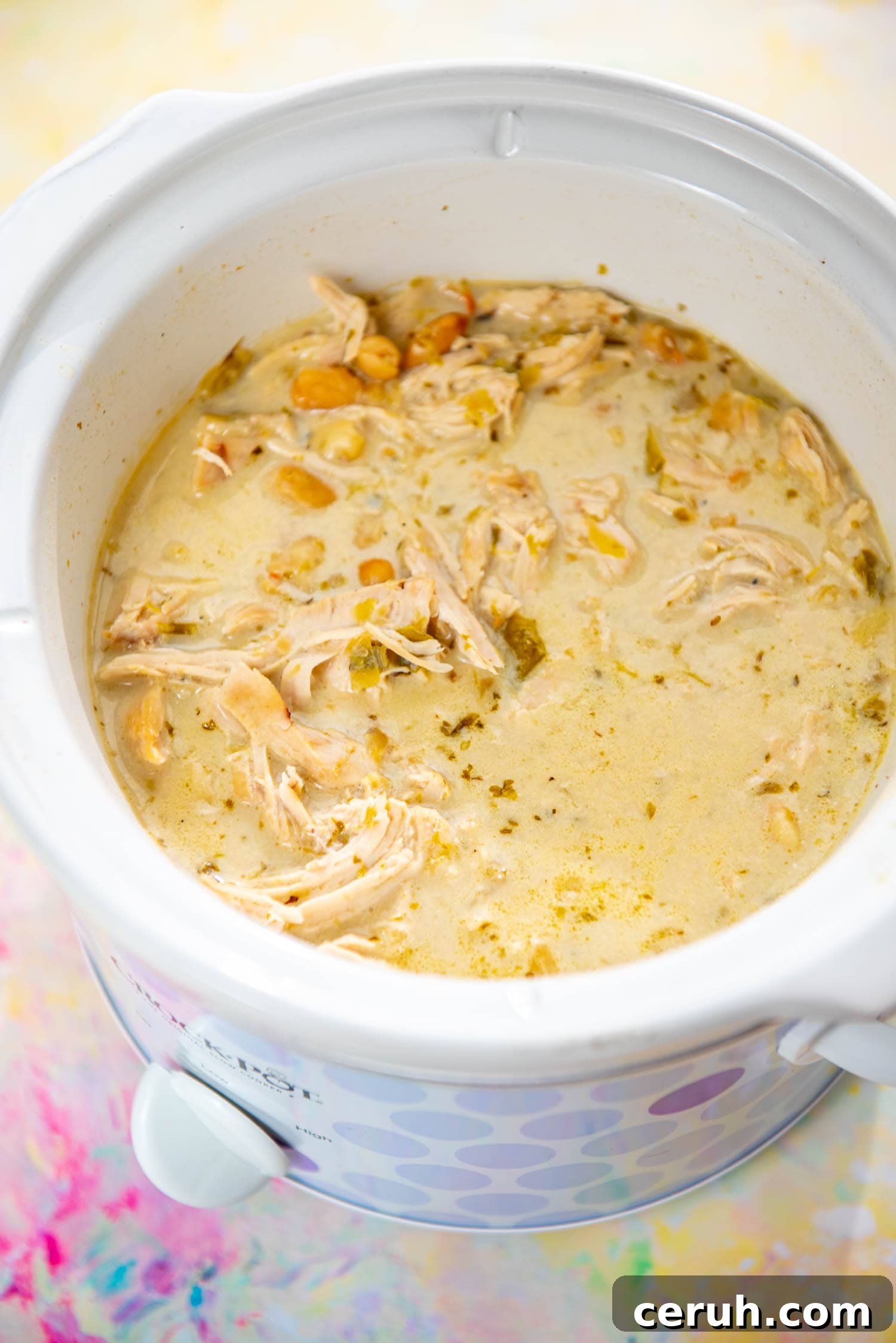 purple polk-a-dot slow cooker filled with white chicken chili