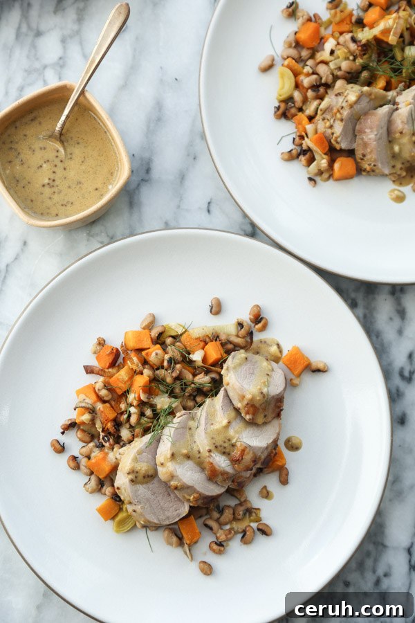 roasted pork tenderloin sliced on a plate