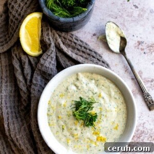 Dressing in a white bowl with a spoon.