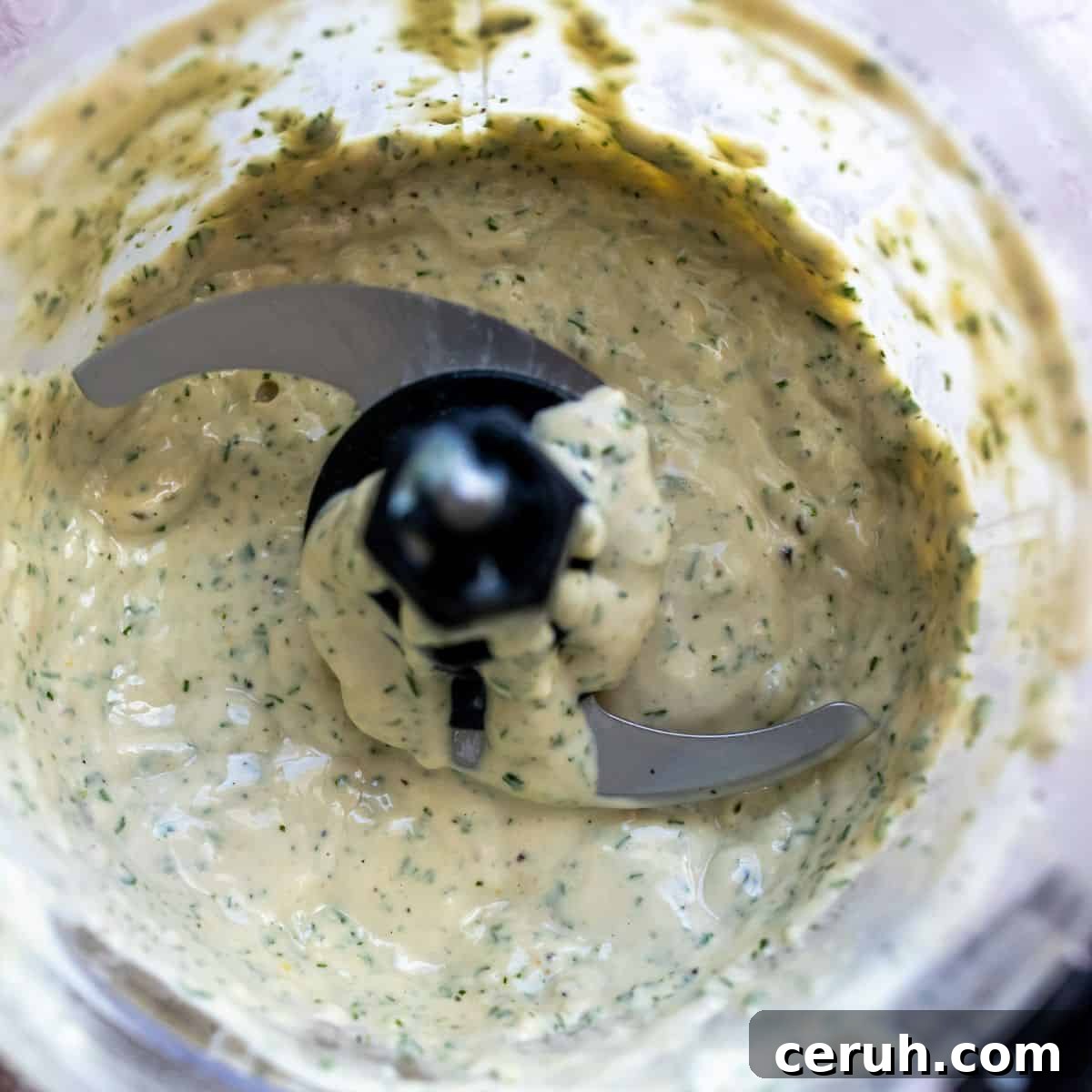 Lemon herb tahini in a blender up close