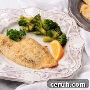 Keto parmesan crusted flounder with broccoli.
